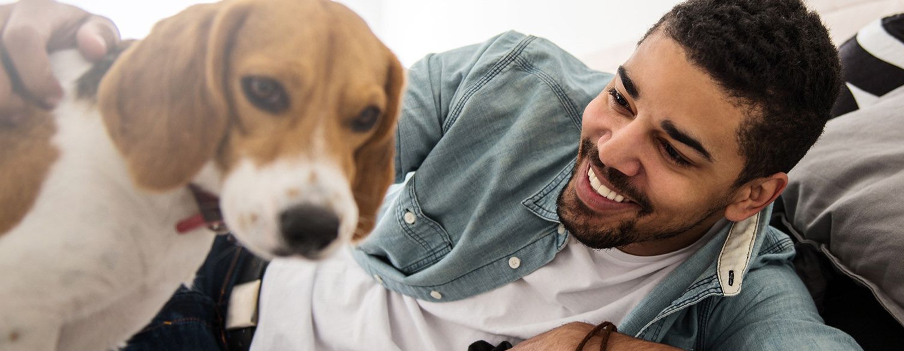 man smiling with his dog