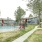 Landscaped grounds with a pool and fence