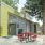 Apartment building exterior with red picnic table