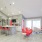 Apartment leasing office with kitchen and pink furniture