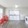 Laundry room with washers, dryers, and tables